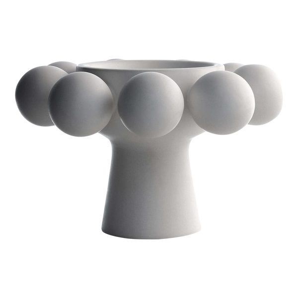 The Nimbus Footed Bowl Alabaster by KleinReid features a modern design with hand-appliquéd porcelain spheres adorning its wide top and round base, all in a sleek alabaster finish.