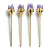 The Anna New York Hospitality Cocktail Picks, Gold & Amethyst Druze (Set of 4), feature gold-plated picks each topped with amethyst crystals, arranged vertically in a row against a white background.