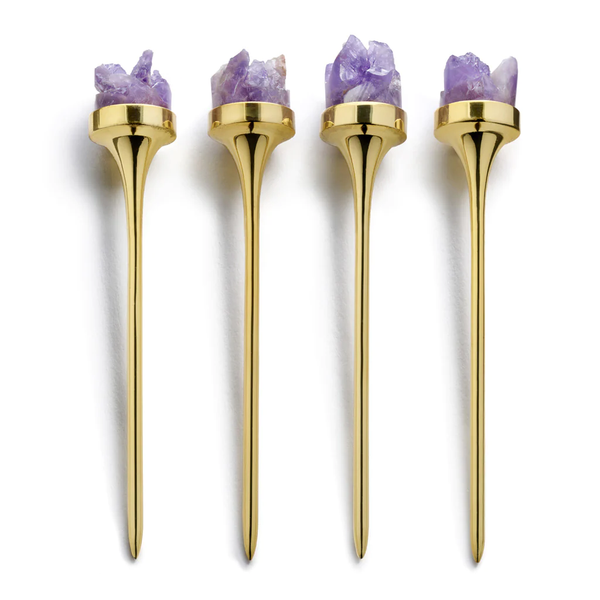 The Anna New York Hospitality Cocktail Picks, Gold & Amethyst Druze (Set of 4), feature gold-plated picks each topped with amethyst crystals, arranged vertically in a row against a white background.