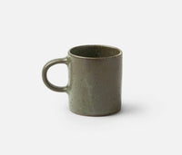 The Marcus Gray Salt Dinnerware Set of 4 by Blue Pheasant includes a rustic, speckled olive-green ceramic mug with a C-shaped handle—an artisanal piece ideal for any modern table setting.