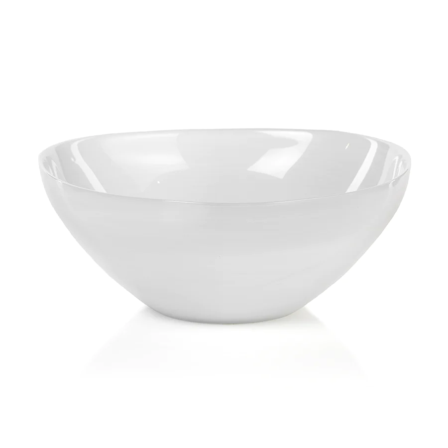 The Monte Carlo White Alabaster Bowl by Zodax, featuring glossy ceramic and smooth, curved sides, sits elegantly on a white surface against a white background.