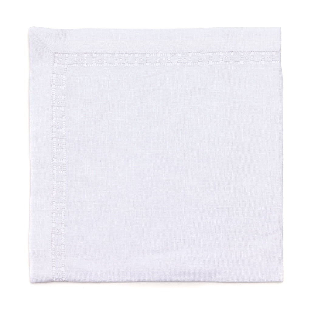 The Deborah Rhodes Embroidered Heirloom Napkin Set of 4 features elegantly folded white linen napkins with subtle border detailing, perfect for elevating any table setting.