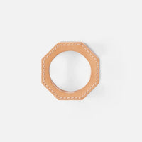 The Arthur Leather Camel Napkin Ring Set of 4 by Blue Pheasant features tan, octagonal full-grain leather napkin rings with visible white stitching, shown against a plain white background.
