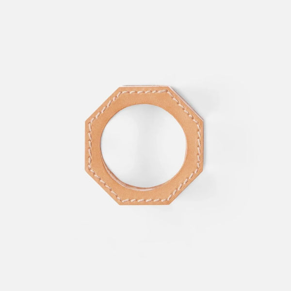 The Arthur Leather Camel Napkin Ring Set of 4 by Blue Pheasant features tan, octagonal full-grain leather napkin rings with visible white stitching, shown against a plain white background.