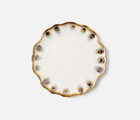 The Amoria Dinnerware by Blue Pheasant features a round ceramic plate with scalloped edges, a white center, and a brown and blue speckled rim, bringing vintage-inspired charm to any light table setting.