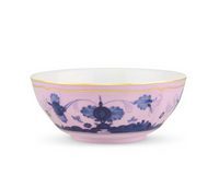 The Ginori 1735 Oriente Italiano Dinnerware Azalea is a porcelain bowl featuring a pale pink exterior with blue chinoiserie floral motifs, a thin gold rim at the top, and a white interior.
