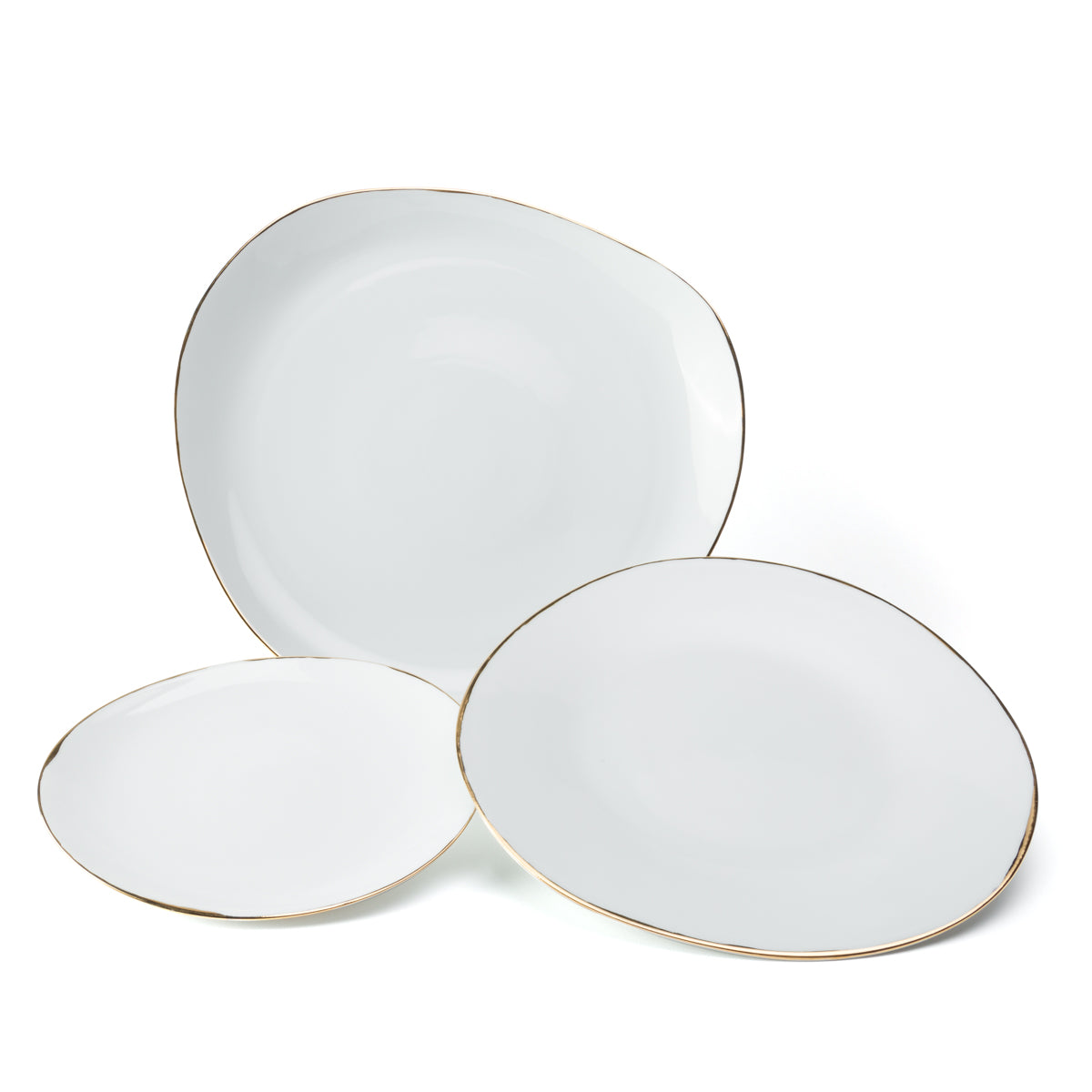 The Molecot Simply Gold Dinnerware set features three white Limoges porcelain plates in varying sizes, each with an irregular, organic shape and thin gold rims—a modern, handcrafted tableware collection.
