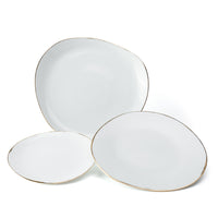 The Molecot Simply Gold Dinnerware set features three white Limoges porcelain plates in varying sizes, each with an irregular, organic shape and thin gold rims—a modern, handcrafted tableware collection.