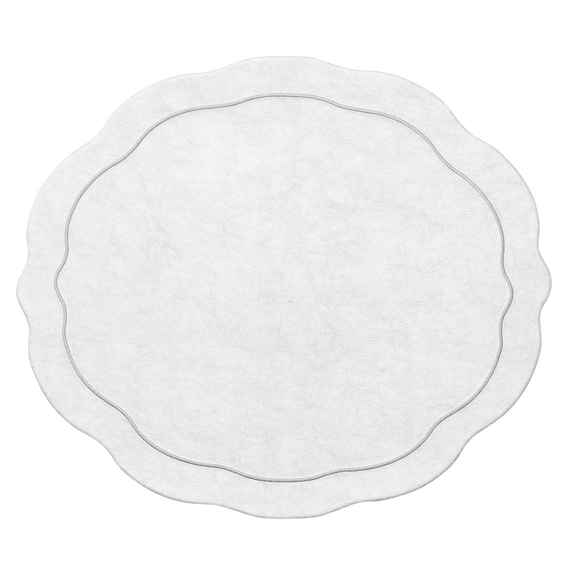 The Kim Seybert Tailored Placemat Set of 4 in Silver features round faux leather mats with a subtle textured pattern, scalloped edges, and a double-lined border near the edge.