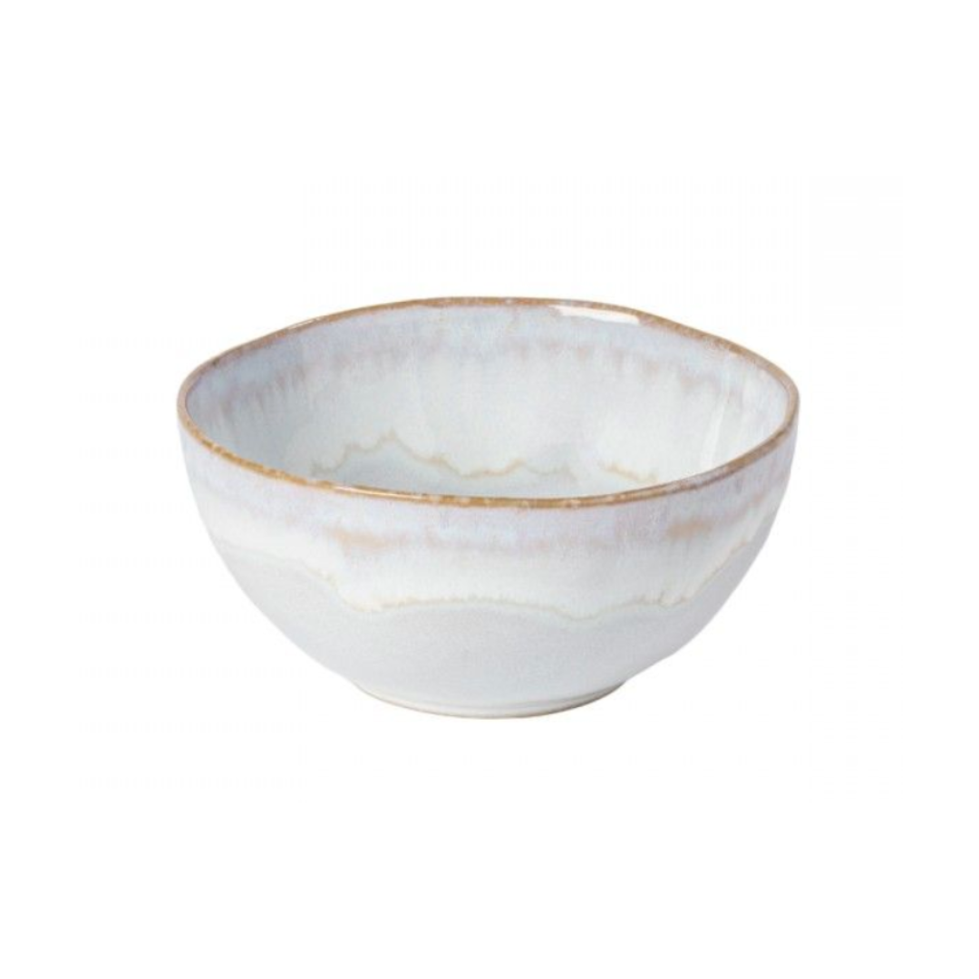 The Brisa Sal Dinnerware by Casafina/Costa Nova is a stoneware bowl with a wavy rim, white glaze, and beige-grey accents, inspired by the Algarve coast, shown on a plain white background.