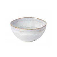 The Brisa Sal Dinnerware by Casafina/Costa Nova is a stoneware bowl with a wavy rim, white glaze, and beige-grey accents, inspired by the Algarve coast, shown on a plain white background.