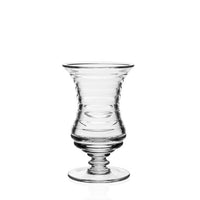 The William Yeoward Ripples Footed Vase, featuring a ribbed glass body, wide flared rim, and sturdy round base, is displayed on a plain white background—ideal for flower arrangements.