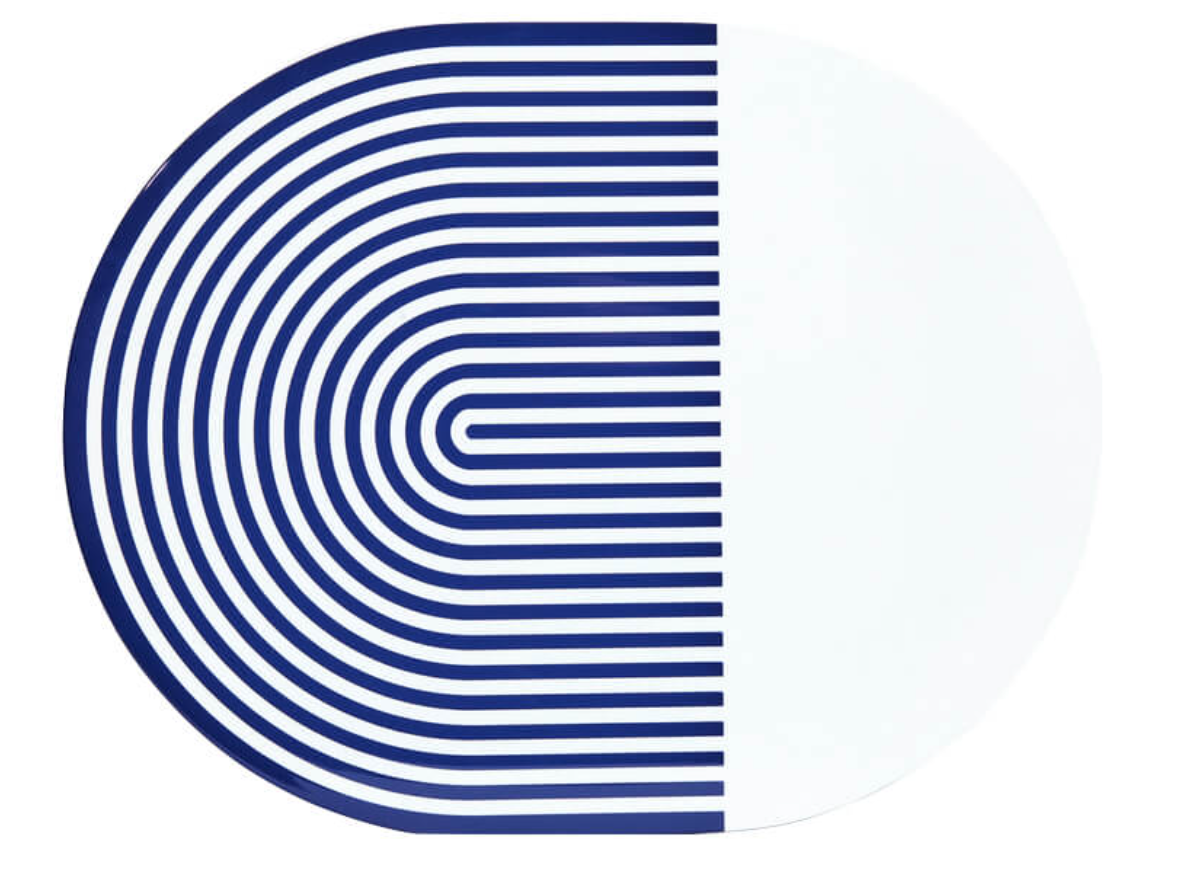 The Stripes & Solids Lacquer Placemat Set of 4 by Von Gern Home features round white placemats, each with one half boldly patterned in curved navy lines and the other half plain—a modern, stylish table accent.