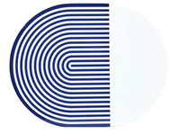 The Stripes & Solids Lacquer Placemat Set of 4 by Von Gern Home features round white placemats, each with one half boldly patterned in curved navy lines and the other half plain—a modern, stylish table accent.