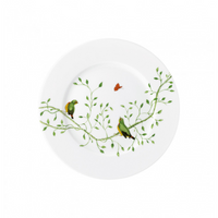 Raynaud’s Histoire Naturelle Dinnerware features a white plate adorned with green leafy vines, two rare birds on branches, and a small orange butterfly—perfect for adding elegance to any dining setting.