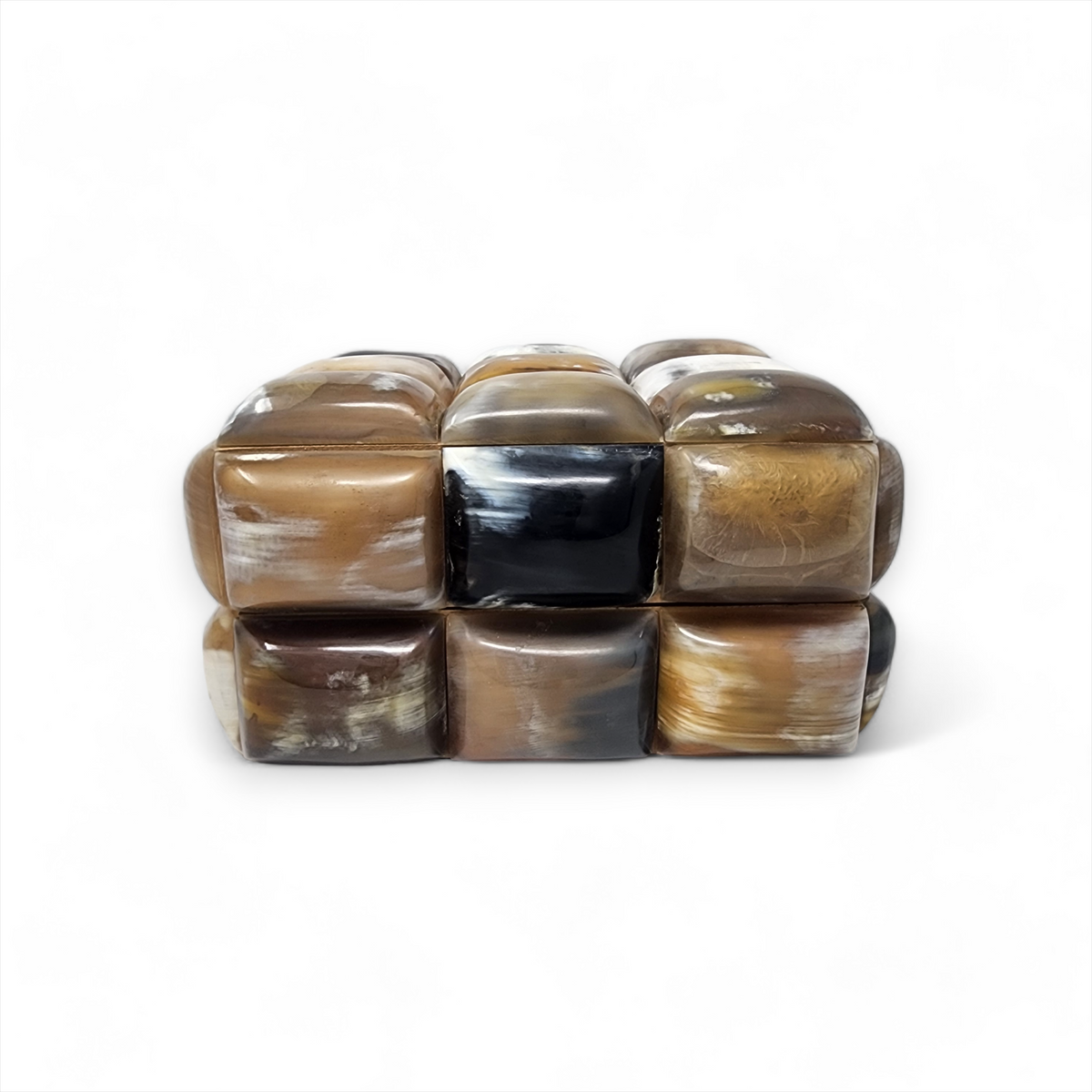 The Bubble Horn Box by A Sanoma Inc features nine polished, rounded square tiles in brown, black, and cream set in a 3x2 grid—ideal as whimsical décor or a unique box to accent any space.