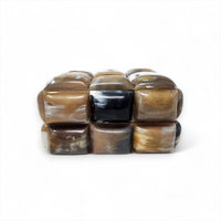 The Bubble Horn Box by A Sanoma Inc features nine polished, rounded square tiles in brown, black, and cream set in a 3x2 grid—ideal as whimsical décor or a unique box to accent any space.