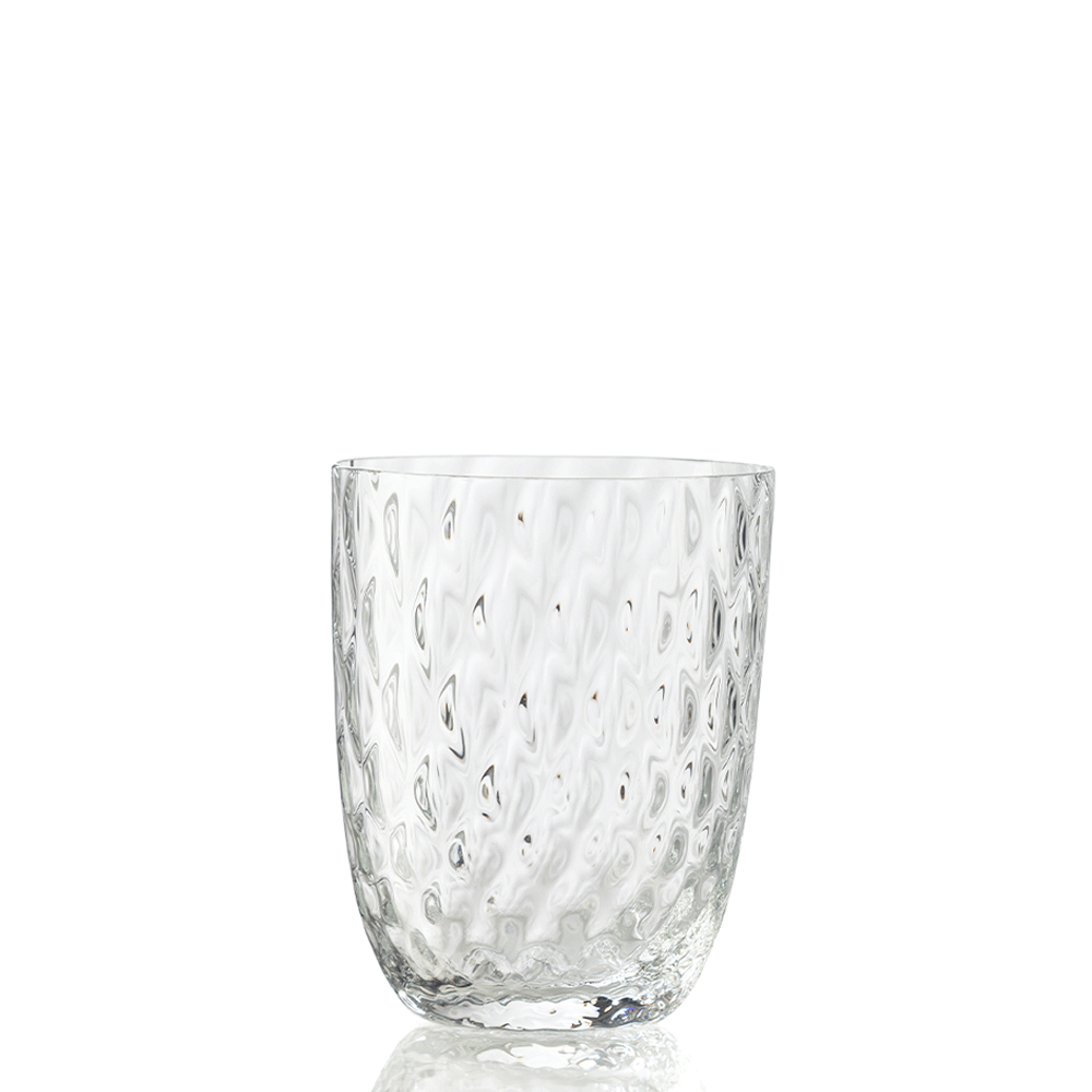 The Idra Tumbler Balloton by Nason Moretti is a clear drinking glass featuring a wavy, dimpled texture and is shown upright on a white background.