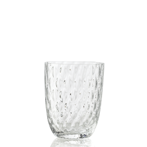 The Idra Tumbler Balloton by Nason Moretti is a clear drinking glass featuring a wavy, dimpled texture and is shown upright on a white background.
