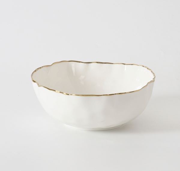 The PAMPA BAY Portofino Serving Bowl features a wavy rim and elegant gold trim, crafted from white porcelain—an ideal addition to your oven-to-table collection.