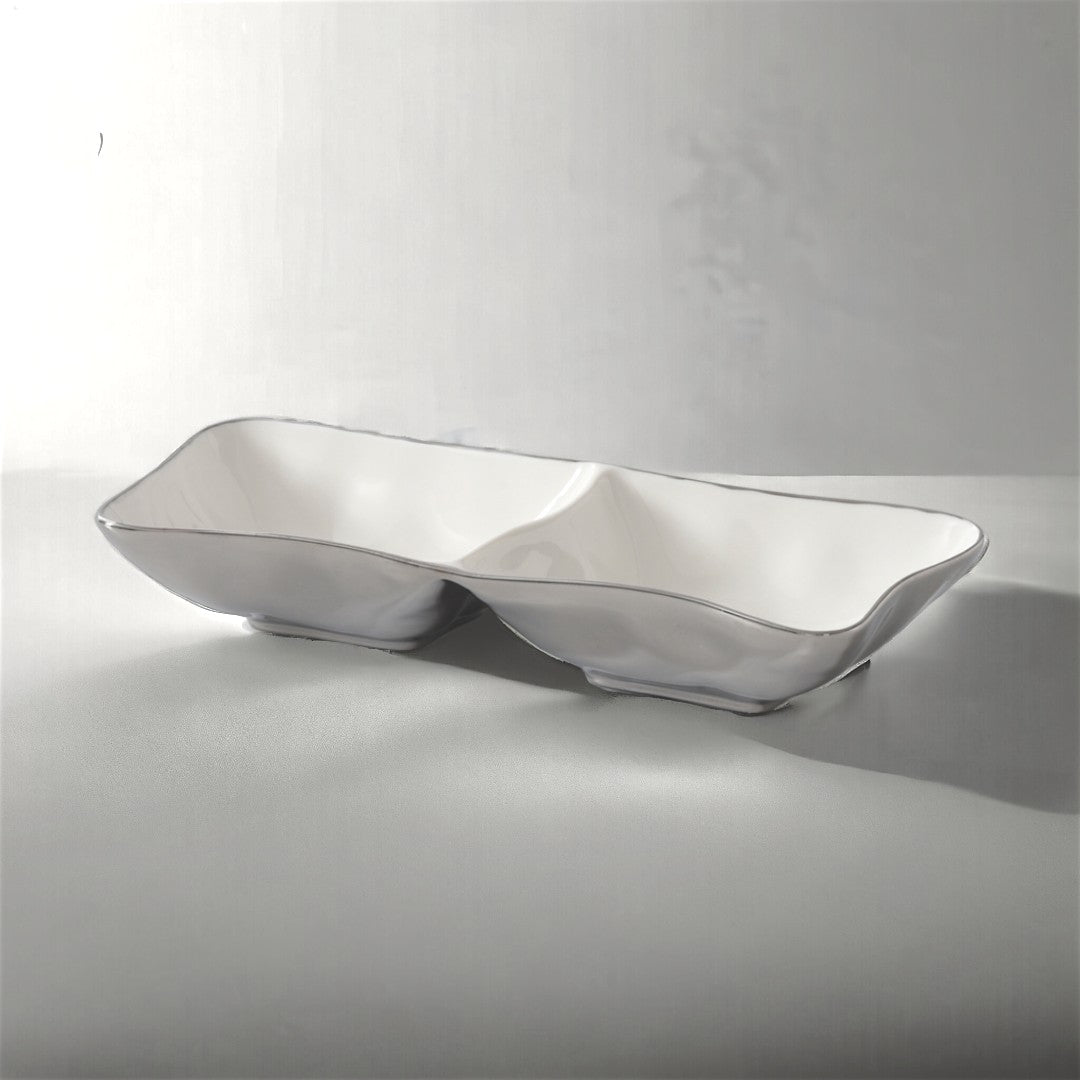 The PAMPA BAY Thin & Simple 2 Section Serving Bowl is a rectangular, white porcelain dish ideal for oven-to-table use, shown here on a light gray surface with soft shadows.