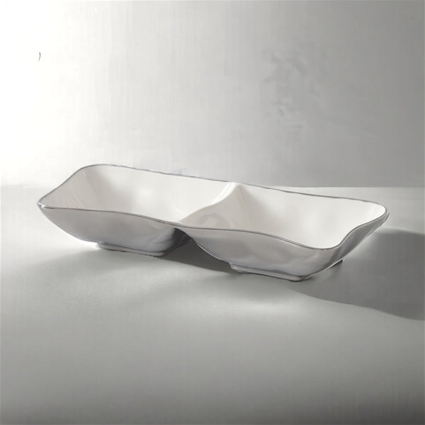 The PAMPA BAY Thin & Simple 2 Section Serving Bowl is a rectangular, white porcelain dish ideal for oven-to-table use, shown here on a light gray surface with soft shadows.