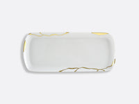 The Bernardaud Kintsugi Dinnerware is a rectangular white ceramic plate with a glossy finish, accented by gold lines and patches inspired by the Japanese art of repairing pottery with gold. Ideal for elegant dinnerware collections.