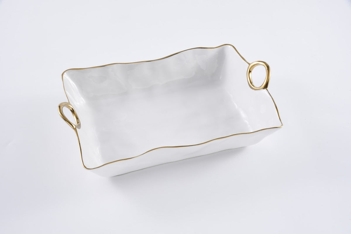 The PAMPA BAY Golden Handle Large Deep Server is a rectangular white ceramic dish with wavy edges, two gold-tone handles, and a thin gold trim along the rim, shown against a plain white background.
