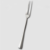 The Mary Jurek Alta Meat Serving Fork, crafted from stainless steel with two sharp prongs and a textured handle, is displayed on a plain light gray background—a sleek serveware addition.