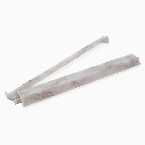Two white, marble-patterned plastic drawer dividers from the Oh My Mahjong brand are shown on a plain white background. Inspired by the sleek design of the Mahjong Rack & Pusher Set - Carrara, each divider features adjustable ends to fit various drawer sizes.