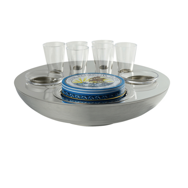 The Ercuis Transat Caviar & Vodka Set includes a round silver tray with grooves, six silver-plated vodka glasses, and a central blue tin—an elegant presentation by Ercuis for serving caviar and vodka.