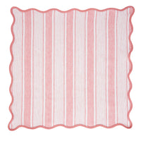 The Juliska Cabana Stripe Napkin Set of 4 in Coral features square cotton linen napkins with pink and white vertical stripes, a wavy pink border, and a scalloped trim, inspired by classic cabana linens.