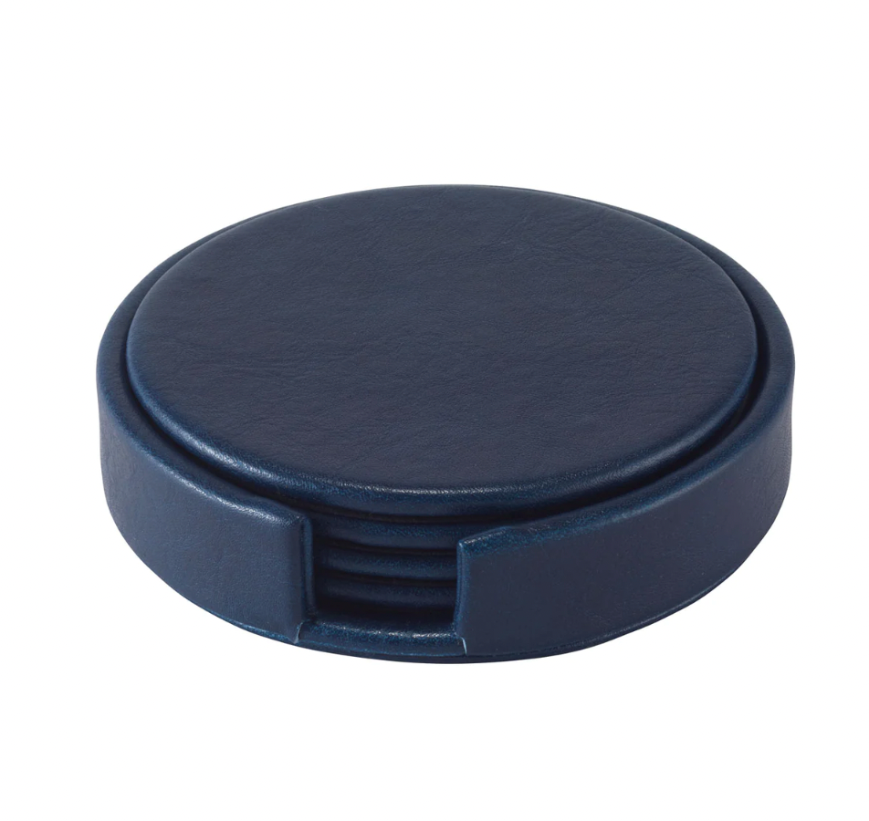 The Bodrum Tanner Coaster Set & Holder features round, dark blue leather coasters in a matching holder, combining stylish elegance with protection for your furniture.
