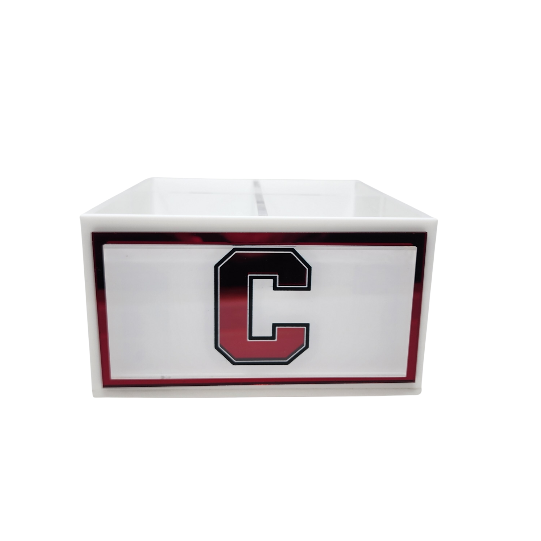The Eye Candy College Spinner is a white rectangular box featuring a red and black-bordered letter C on the front, ideal for organizing your college desk. The background is plain white.