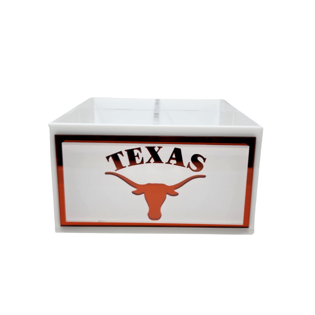 Eye Candy’s College Spinner features a white box with a front label displaying "TEXAS" in black above a burnt orange longhorn silhouette—outlined in burnt orange—making it the perfect desk organizer for college fans.