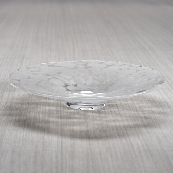 The Zodax Confetti Glass Bowl 14.25" features a shallow, clear hand-blown design with a wide rim and white marbled texture, displayed here on a light gray striped surface.