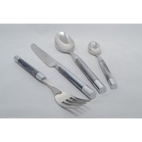 The Capdeco Conty Flatware 5 Piece Setting in Grey features French-made utensils with shiny metal heads and smooth silver-gray handles, arranged here on a light gray surface.