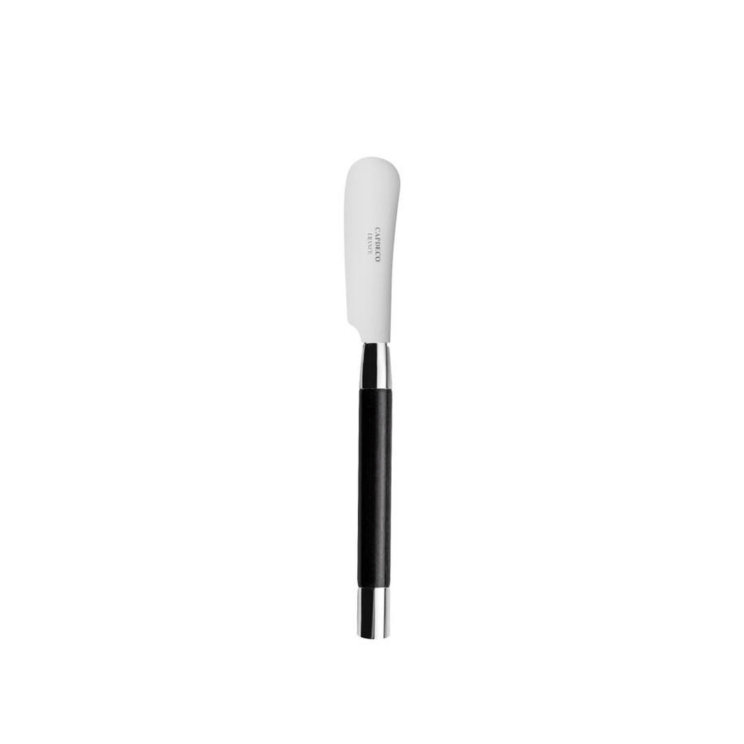 The Capdeco1 Conty Black Wood Butter Spreader is handcrafted in France from stainless steel, with an ergonomic black handle and rounded white blade, shown against a plain white background.