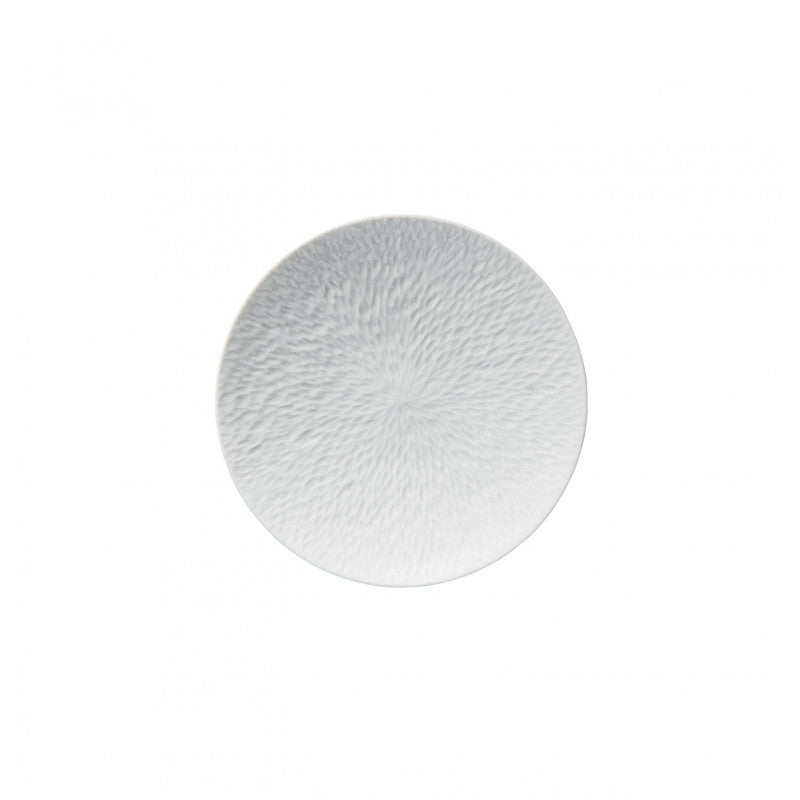 A round Raynaud Mineral Dinnerware Glazed White porcelain plate with a subtle textured pattern is shown from above on a plain white background.