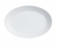 The Raynaud Mineral Dinnerware Glazed White oval plate is made from fine Limoges porcelain and features a subtle textured rim, shown against a white background.