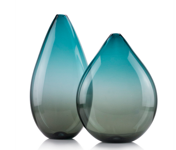 Two Nate Cotterman Double Ombre Teardrop Turquoise & Smoke Vases feature a handblown design with smooth gradient from teal to clear, displayed side by side on a white background.