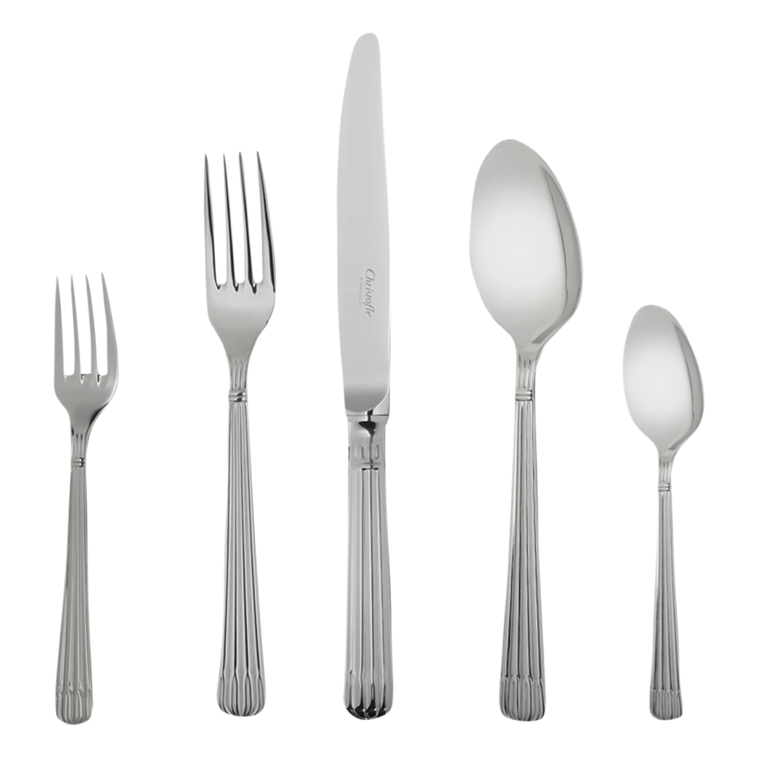The Christofle Osiris Flatware 5 Piece Setting in stainless steel—salad fork, dinner fork, knife, soup spoon, and teaspoon—is displayed upright with matching fluted handles for an elegant look against a white background.