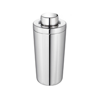 The Christofle Oh De Stainless Steel Shaker features a sleek, shiny finish and a rounded, detachable lid, making it an elegant drink mixer. It is shown against a plain white background.