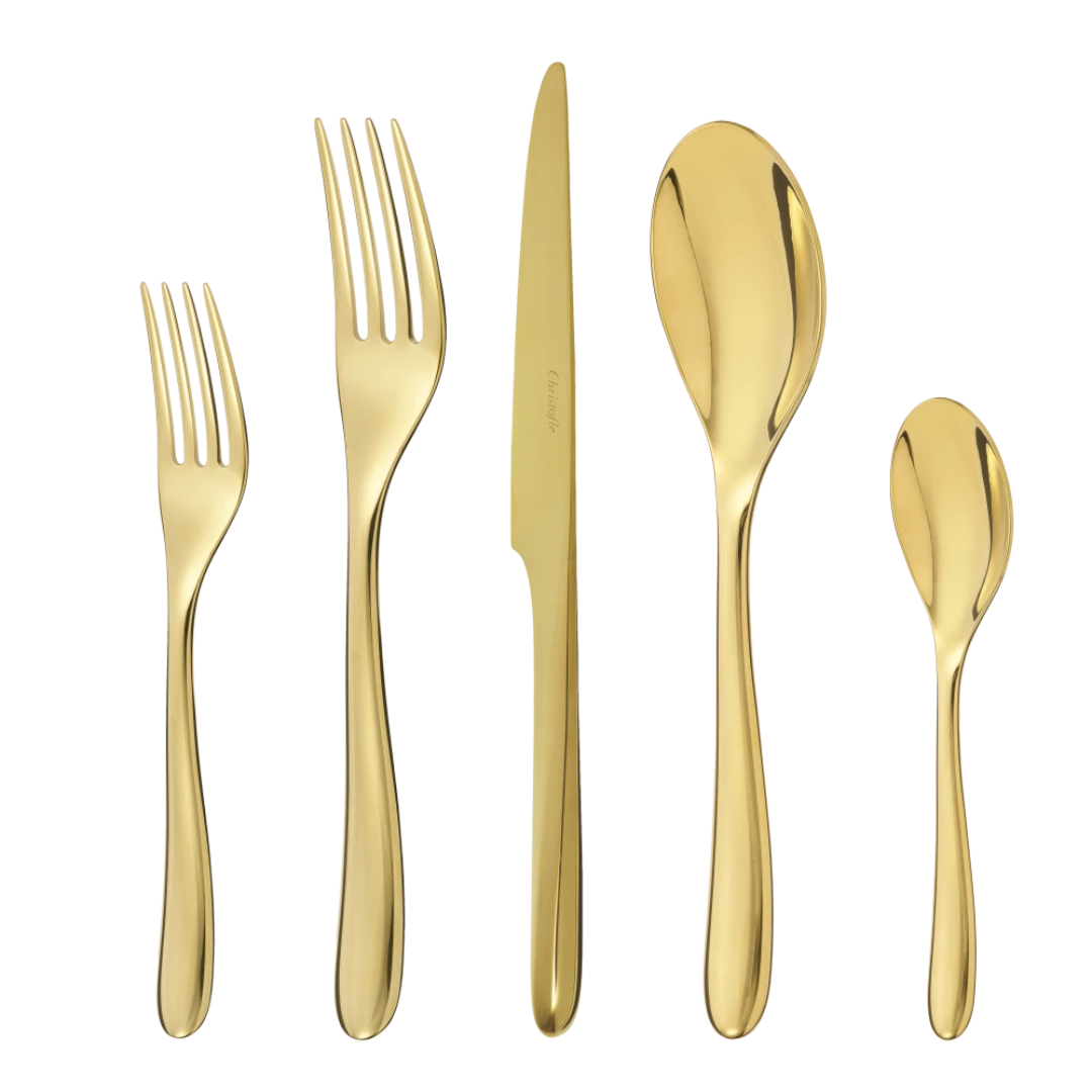 The Christofle L'Ame De Flatware 5 Piece Setting in gold features a salad fork, dinner fork, knife, soup spoon, and teaspoon arranged elegantly side by side on a white background.