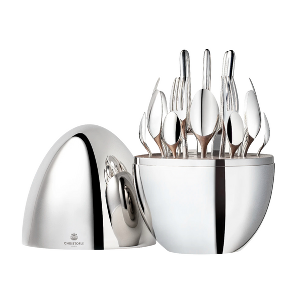 The Christofle Mood Flatware 24 Piece Set - Silver Plated features a sleek silver egg that opens to display arranged forks, knives, and spoons, with the lid placed beside the base on a white background.
