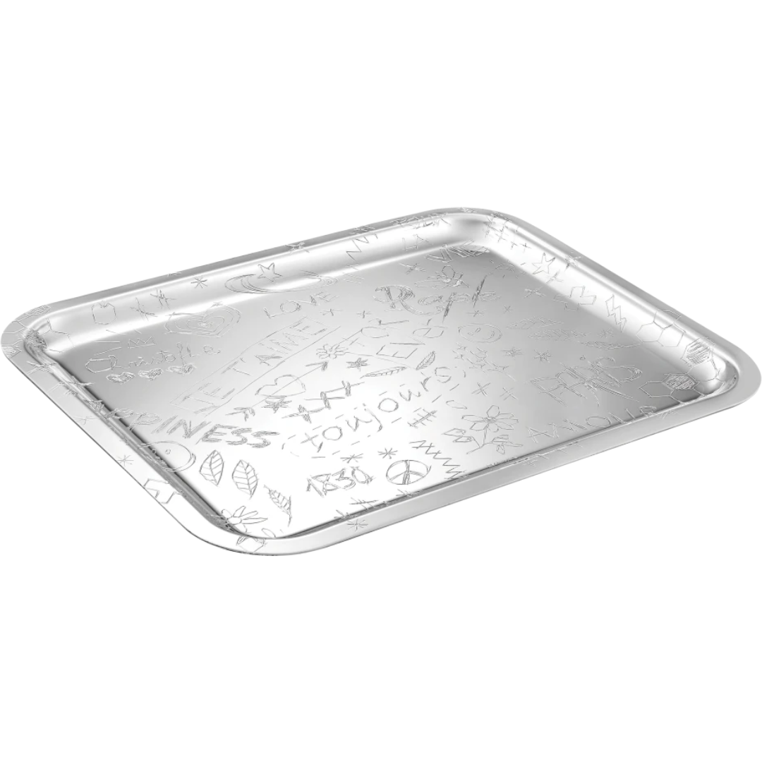 The LOVE Graffiti Christofle Silver Plated Tray by Christofle is rectangular with raised edges, featuring engraved symbols, shapes, and words across its surface, shown at an angle on a white background.
