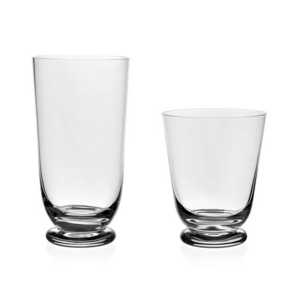 Two clear William Yeoward Classic Footed Drinkware glasses stand side by side on a white background—one tall and slender, the other shorter and wider. Both are beautifully crafted and dishwasher safe.