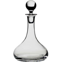 The William Yeoward Classic Ships Decanter is handmade from crystal glass, featuring a wide rounded base, slender neck, and round stopper, shown against a white background.