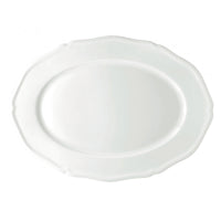 The Raynaud Argent White Dinnerware platter features a plain white, oval-shaped Limoges porcelain design with a subtle scalloped edge, shown on a white background.