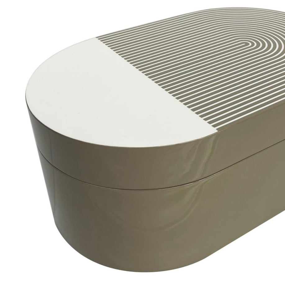 The Lacquer Stripe Box Grey by Von Gern Home is an oval-shaped beige and white box with a lid, featuring a modern geometric striped pattern—ideal for jewelry storage or as a chic accent in contemporary home decor.